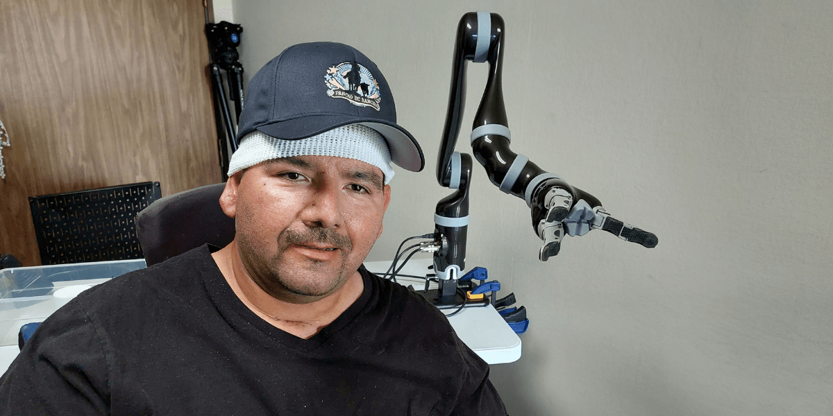 a picture of me with a robot arm besides me