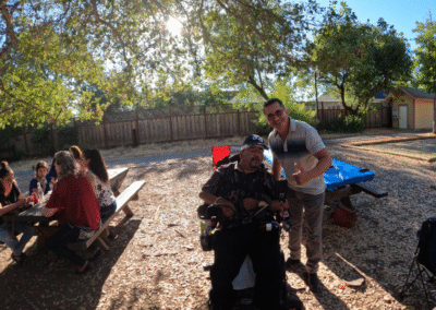 My friend Miguel. There are people sitting around us